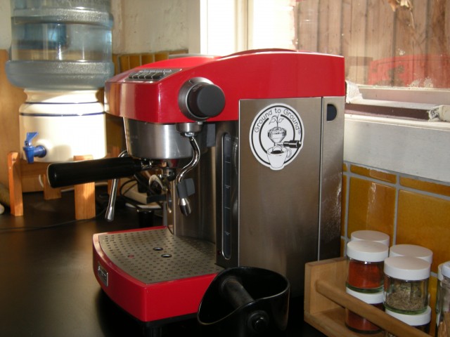 Ground to Ground logo on a coffee machine