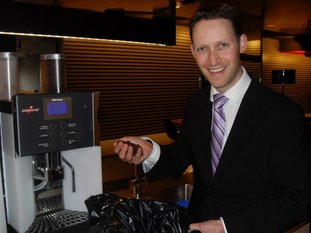 Jono with coffee grounds as part of the Ground to Ground initiative