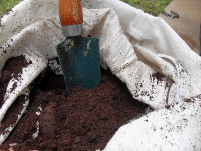 A bag full of coffee grounds for lawn