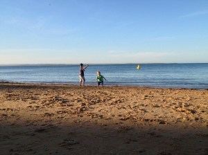boys fighting against the sea