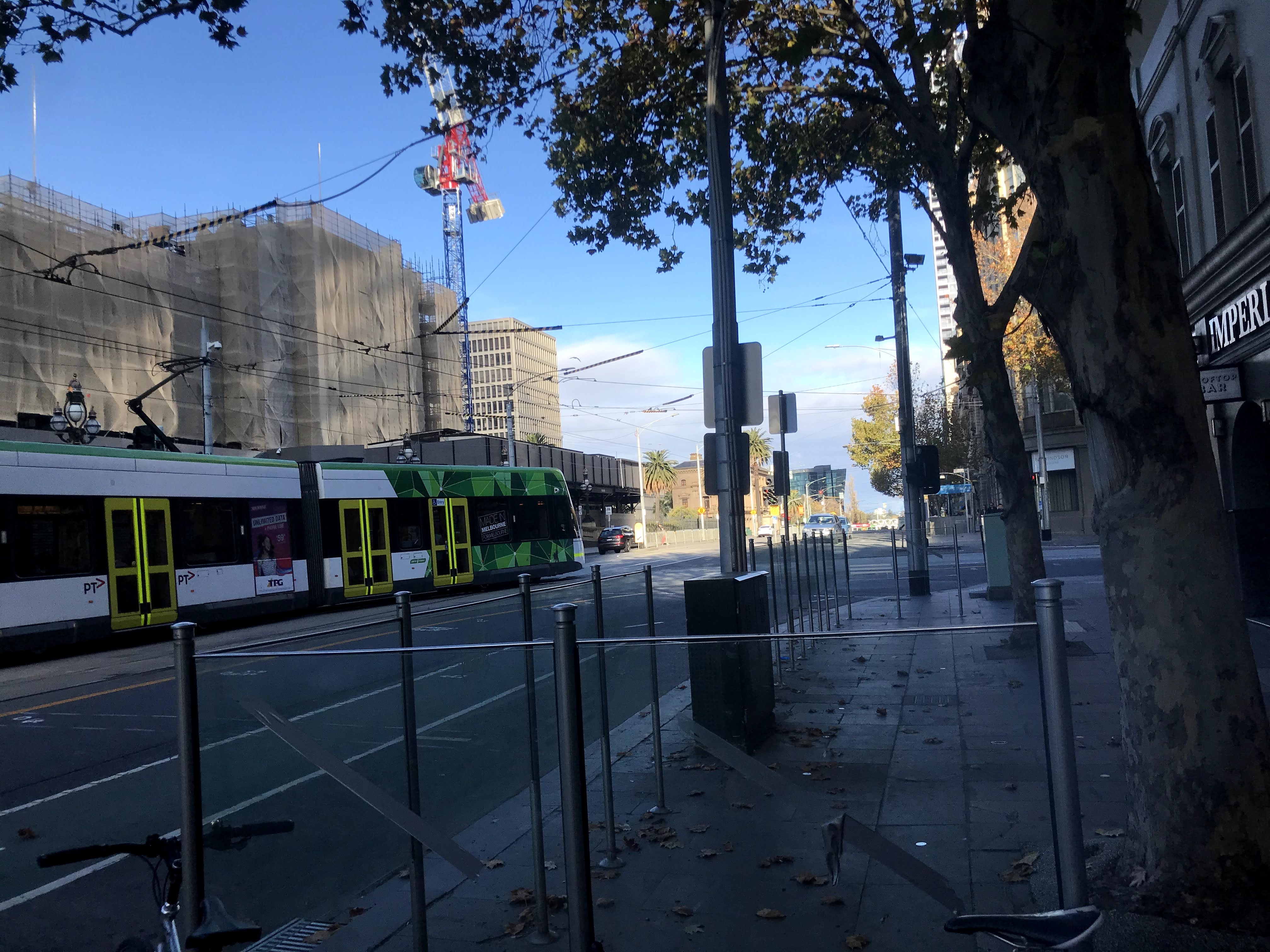 Melbourne city with passing tram